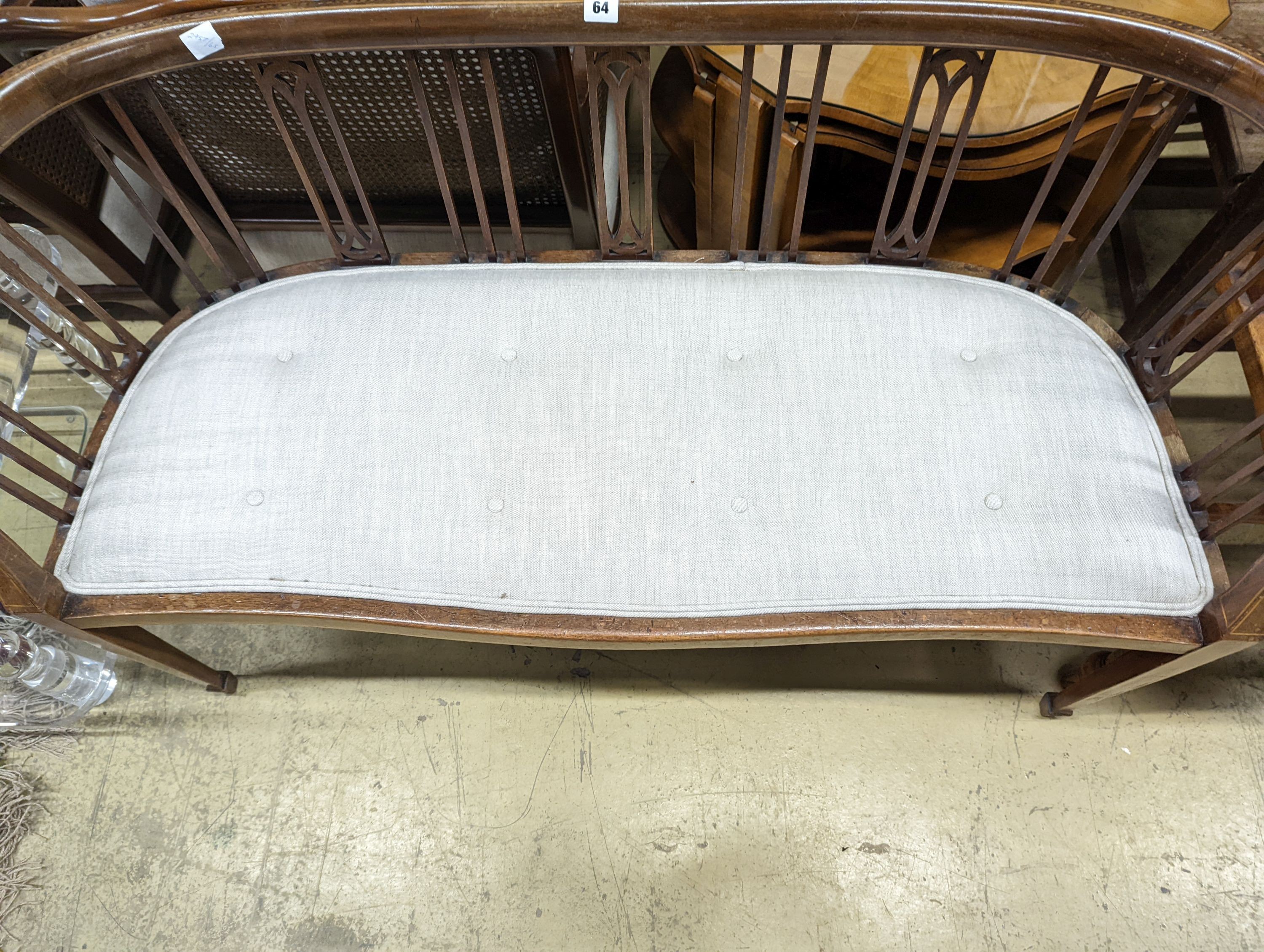 An Edwardian inlaid mahogany slat back settee, length 164cm, depth 47cm, height 74cm